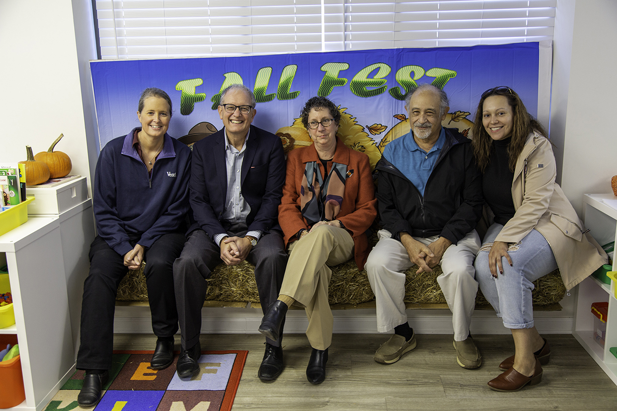 Photo of Vesta employee, Lifelong Learning Board Members and daycare provider.