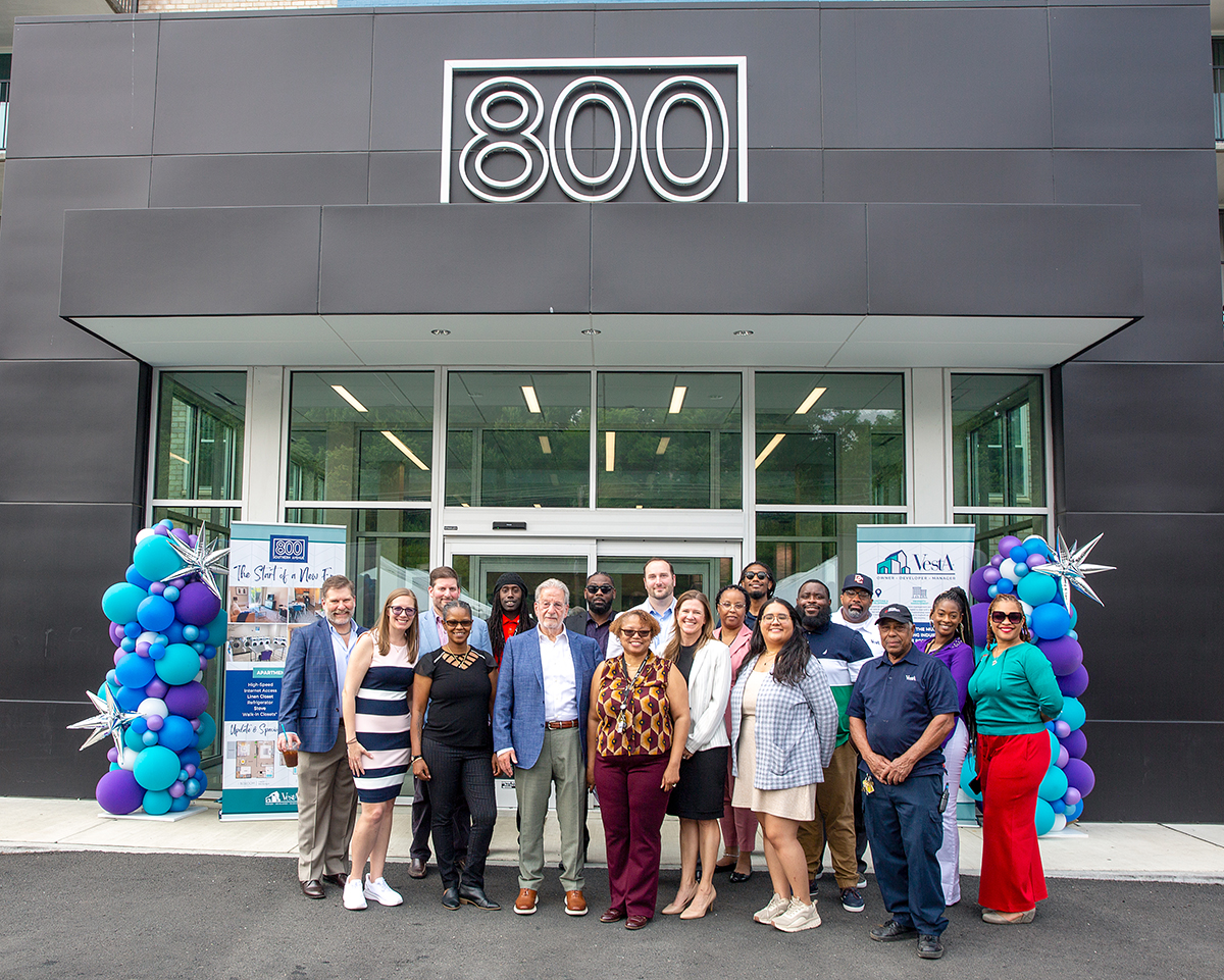 A group of Vesta employees celebrate the 800 Southern Avenue Ribbon Cutting